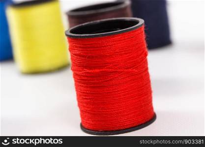 Spools of colorful thread using for needlework, embroidery and sewing. Spools of thread using for embroidery and sewing