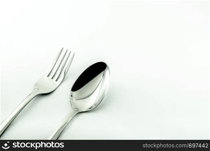 Spoon and fork isolated on white background. Used in advertising and design.