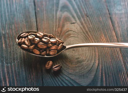 Spoon of coffee beans