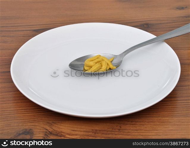 Spoon with mustard