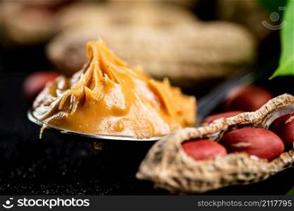 Spoon with peanut butter. Macro background. High quality photo. Spoon with peanut butter. Macro background.
