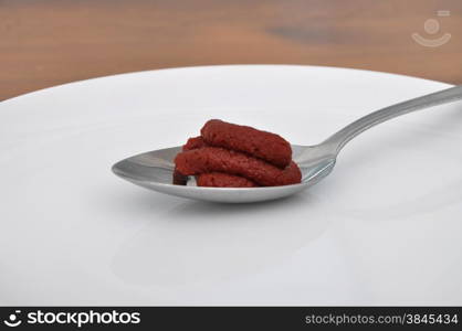 Spoon with tomato puree