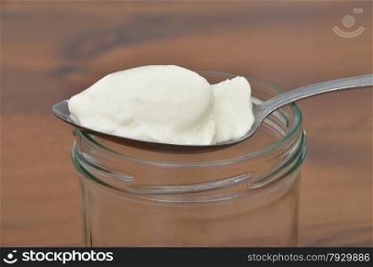 Spoon with yoghurt