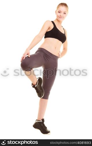 sport and active life. fitness sporty blonde girl young woman in sportswear stretching her leg isolated on white.