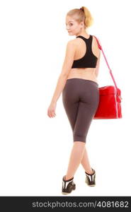 Sport and active lifestyle. Back of fitness sporty girl in sportswear with red gym bag isolated on white.