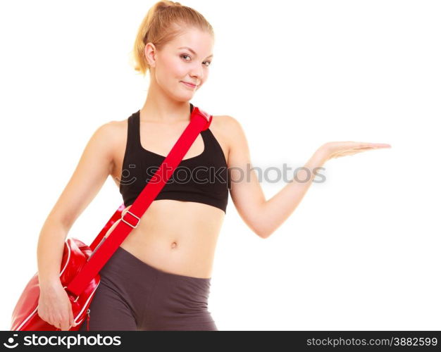 Sport and active lifestyle. Fitness girl in sportswear with gym bag showing copy space on empty hand isolated on white.