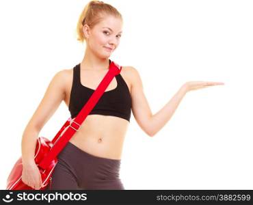 Sport and active lifestyle. Fitness girl in sportswear with gym bag showing copy space on empty hand isolated on white.