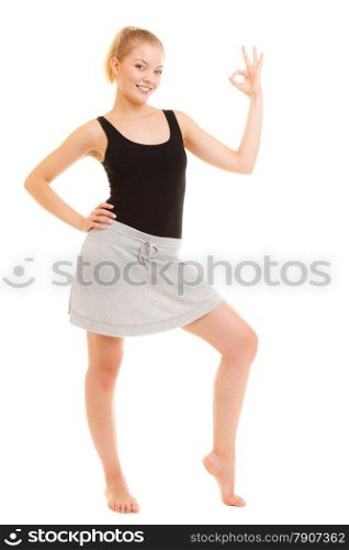 Sport and active lifestyle. Fitness sporty girl in sportswear showing ok okay hand sign gesture isolated on white