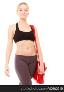 Sport and active lifestyle. Fitness sporty girl in sportswear with red gym bag isolated on white.