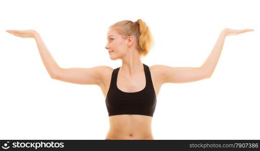 Sport and active lifestyle. fitness sporty girl stretching showing open hands palm with blank copy space for product or text isolated.