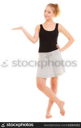 Sport and active lifestyle. Full length of fitness sporty girl showing open hand palm with blank copy space for product or text isolated on white.