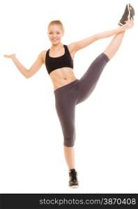 Sport and active lifestyle. Full length of fitness sporty girl stretching showing open hand palm with blank copy space for product or text isolated.