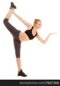 Sport and active lifestyle. Full length of fitness sporty girl stretching showing open hand palm with blank copy space for product or text isolated.