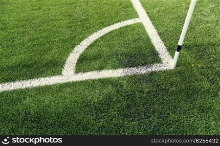 sport and game concept - close up of football field corner with marker. close up of football field corner with marker