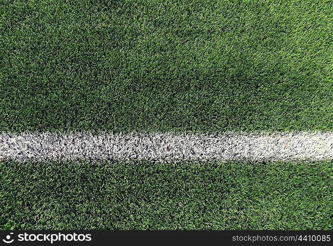 sport and game concept - close up of football field with line and grass. close up of football field with line and grass