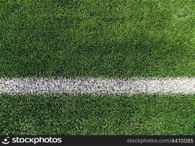 sport and game concept - close up of football field with line and grass. close up of football field with line and grass