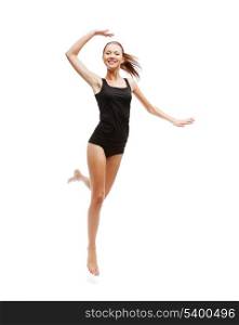 sport and health care concept - beautiful girl jumping in black cotton underwear