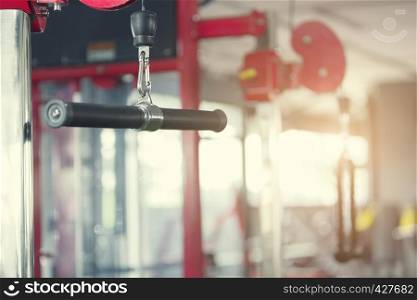 Sport and healthy background concept. Bodybuilding. Exercises machine in the gym with blurred background. Picture for add text message. Backdrop for design art work.