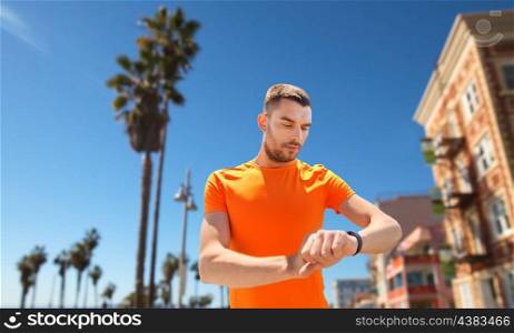 sport and healthy lifestyle concept - man with fitness tracker training outdoors. man with fitness tracker training outdoors. man with fitness tracker training outdoors