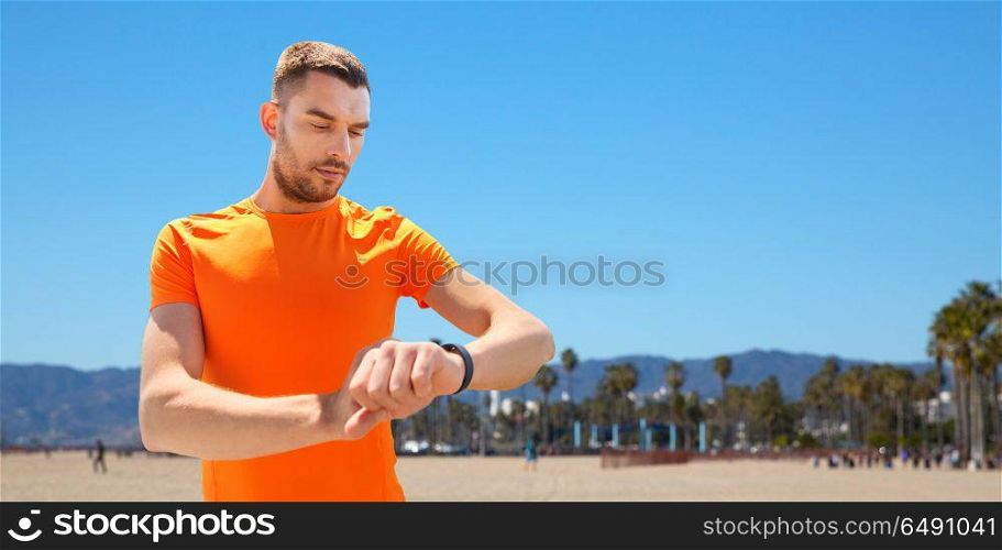 sport and healthy lifestyle concept - man with fitness tracker training outdoors. man with fitness tracker training outdoors. man with fitness tracker training outdoors