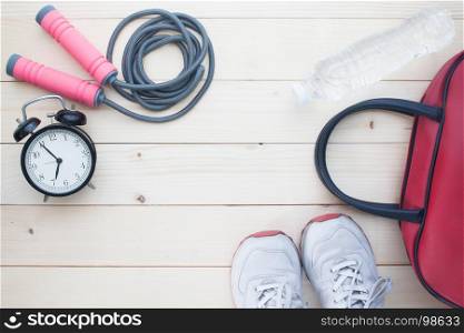 Sport and Healthy lifestyle concept with sport equipment and fitness items on wooden background, Top view