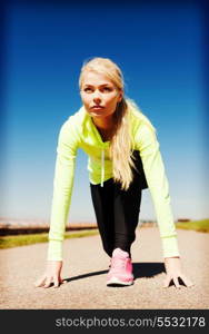 sport and lifestyle concept - woman doing running outdoors