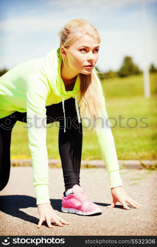 sport and lifestyle concept - woman doing running outdoors