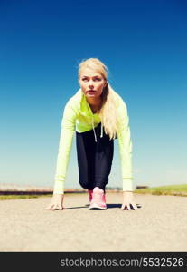 sport and lifestyle concept - woman doing running outdoors