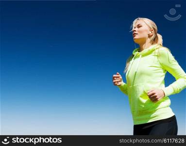 sport and lifestyle concept - woman doing running outdoors. woman doing running outdoors