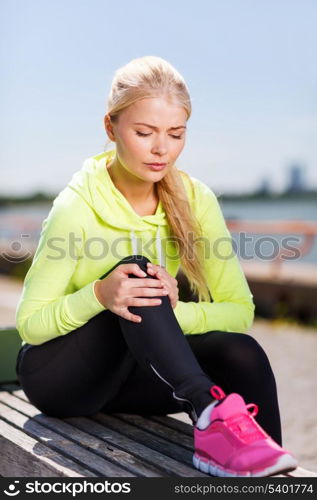 sport and lifestyle concept - woman doing sports outdoors