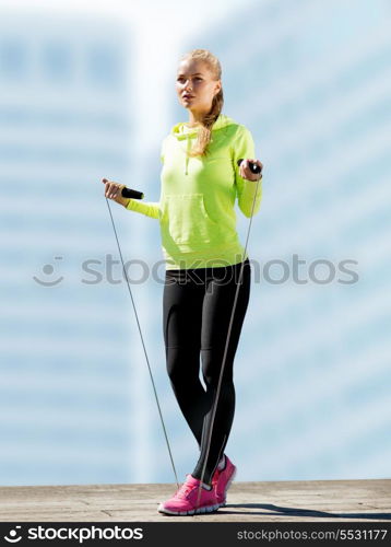 sport and lifestyle concept - woman doing sports outdoors