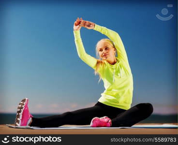 sport and lifestyle concept - woman doing sports outdoors