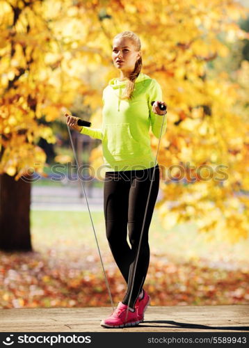 sport and lifestyle concept - woman doing sports outdoors