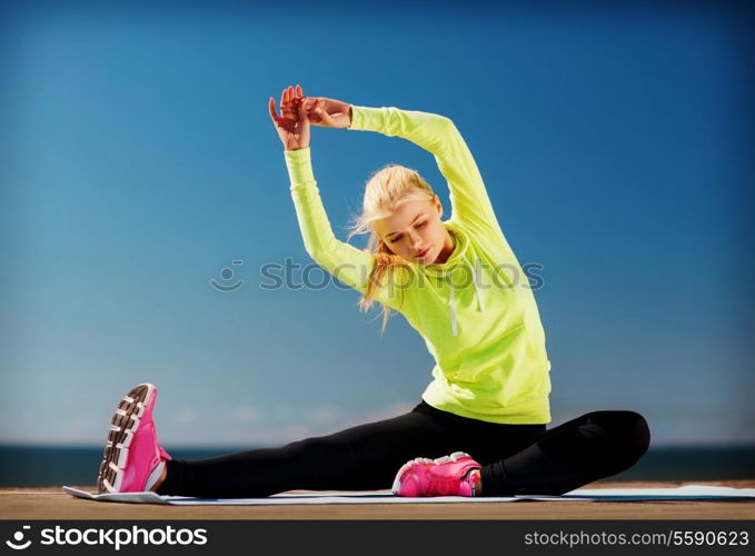 sport and lifestyle concept - woman doing sports outdoors