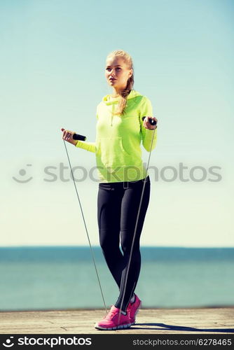 sport and lifestyle concept - woman doing sports outdoors