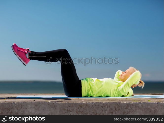 sport and lifestyle concept - woman doing sports outdoors. woman doing sports outdoors