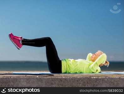 sport and lifestyle concept - woman doing sports outdoors. woman doing sports outdoors