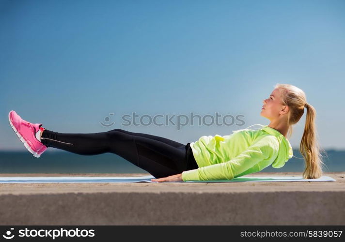 sport and lifestyle concept - woman doing sports outdoors. woman doing sports outdoors