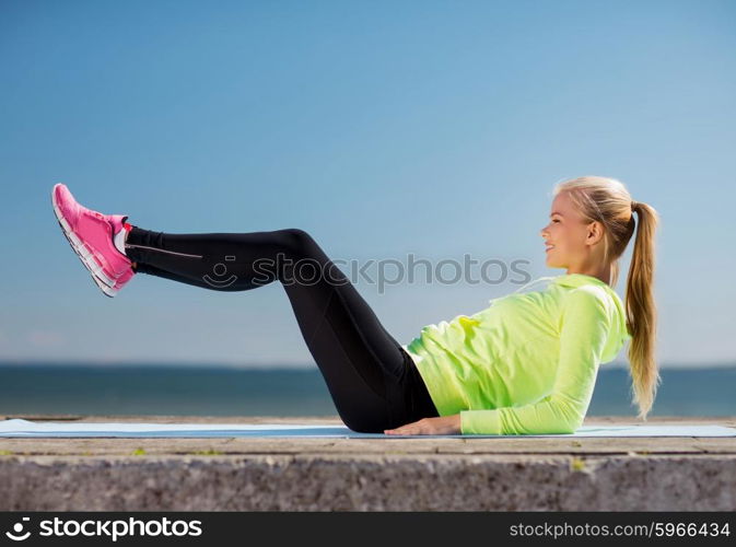 sport and lifestyle concept - woman doing sports outdoors. woman doing sports outdoors