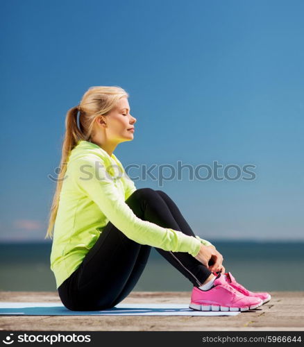 sport and lifestyle concept - woman doing sports outdoors. woman doing sports outdoors