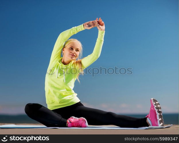 sport and lifestyle concept - woman doing sports outdoors. woman doing sports outdoors