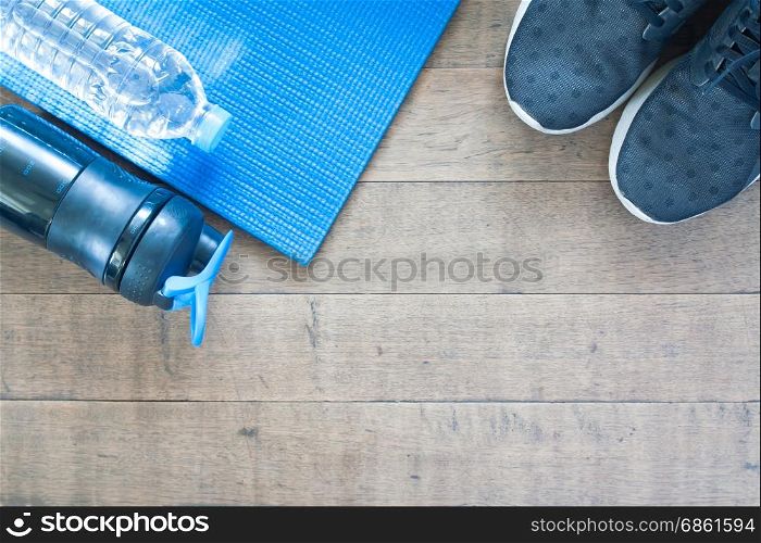 Sport and workout equipment on wood background, Flat lay of healthy lifestyle concept