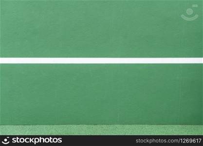 Sport background. Green wall and white line. Copy space