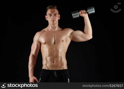 sport, bodybuilding, fitness and people concept - young man with dumbbells flexing muscles over black background. man with dumbbell exercising over black background
