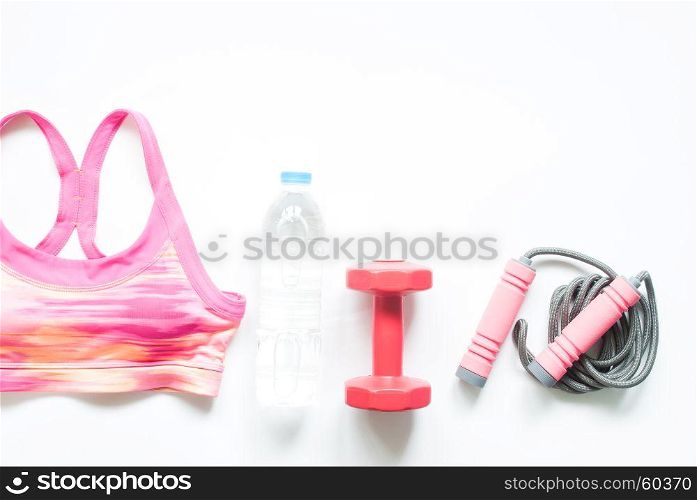 Sport bra, bottle of water and fitness equipments on white background, Workout concept