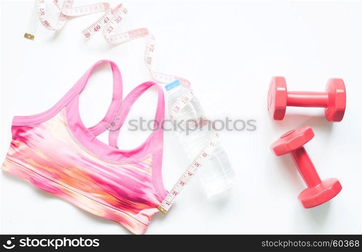 Sport bra, measuring-tape and red dumbbells on white background, Fitness and Gym workout items for Healthy woman