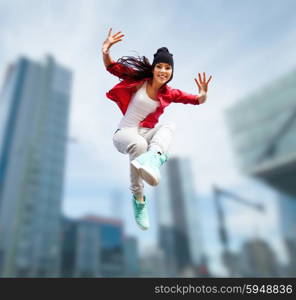 sport, dancing and urban culture concept - beautiful dancing girl jumping