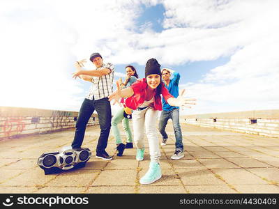 sport, dancing and urban culture concept - group of teenagers dancing