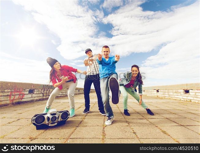 sport, dancing and urban culture concept - group of teenagers dancing