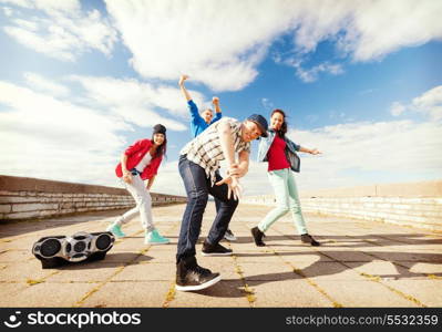 sport, dancing and urban culture concept - group of teenagers dancing